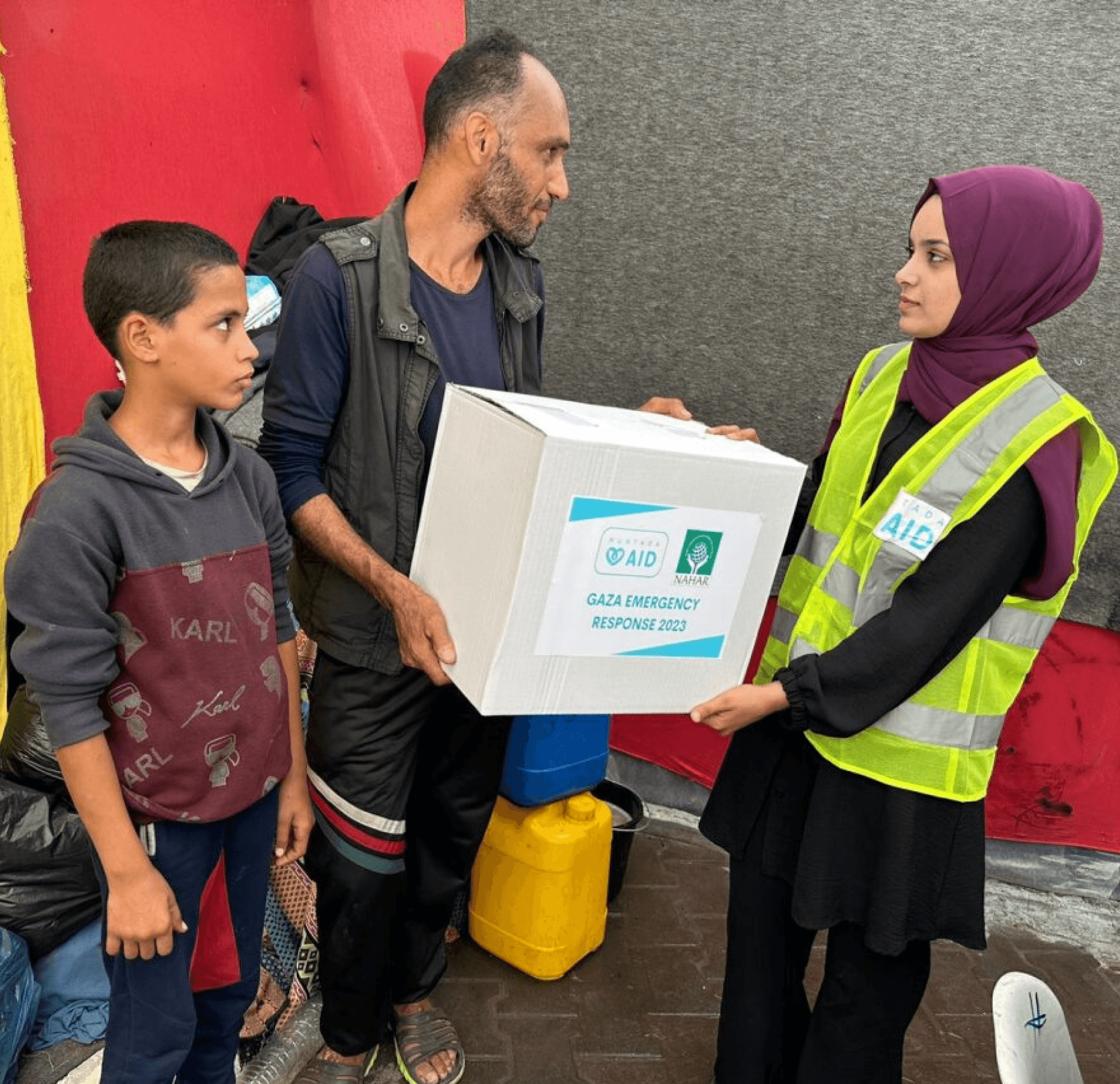 Children in Gaza with Muntada Aid food packs