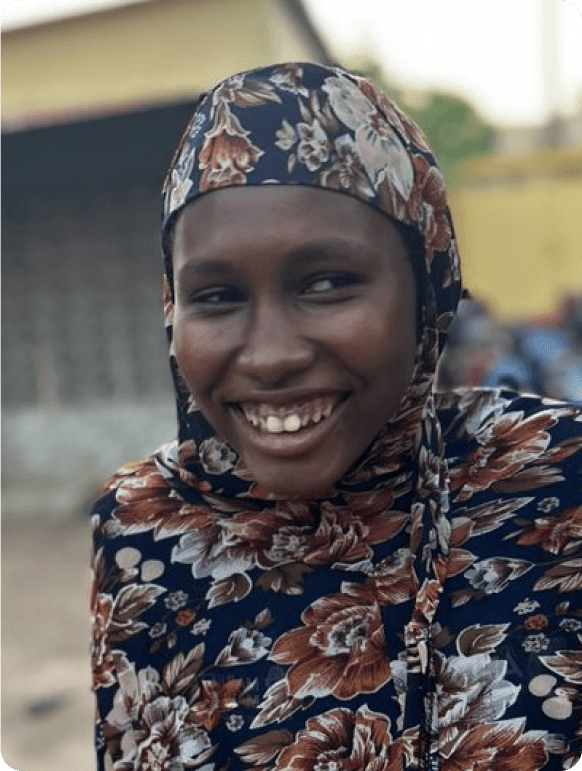 A smiling girl supported by Muntada Aid's education programme in Mali